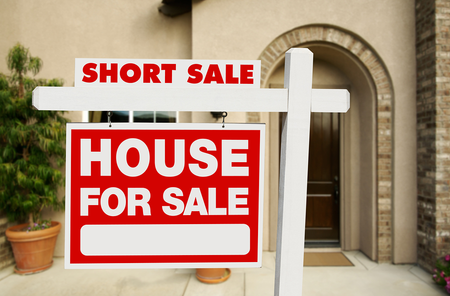 Red Short Sale Real Estate Sign and House.